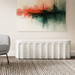 A white outdoor concrete oval bench with arched design pattern set in a living room against white wall with abstract painting