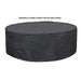 A gray concrete large outdoor fire pit bowl with black fire pit cover