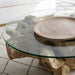 Coffee table with Teak base and glass top. 48 inches in width, 40 inches in depth and 16 inches in height